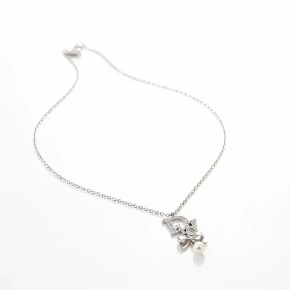 Christian Dior Silver Ribbon Pearl Pendant Necklace - Picture 1 of 6